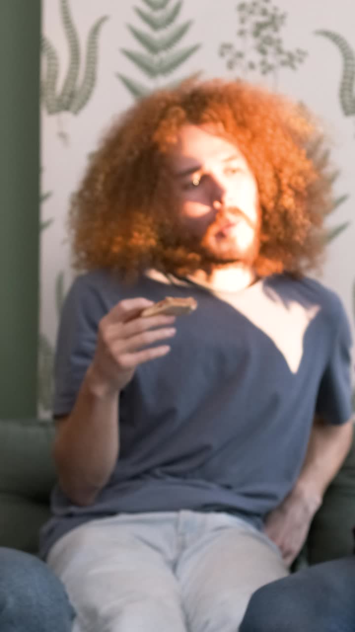 Diverse friends cheering up for woman bringing pizzas during weekend party at home