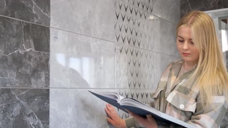 woman selecting tiles in a showroom