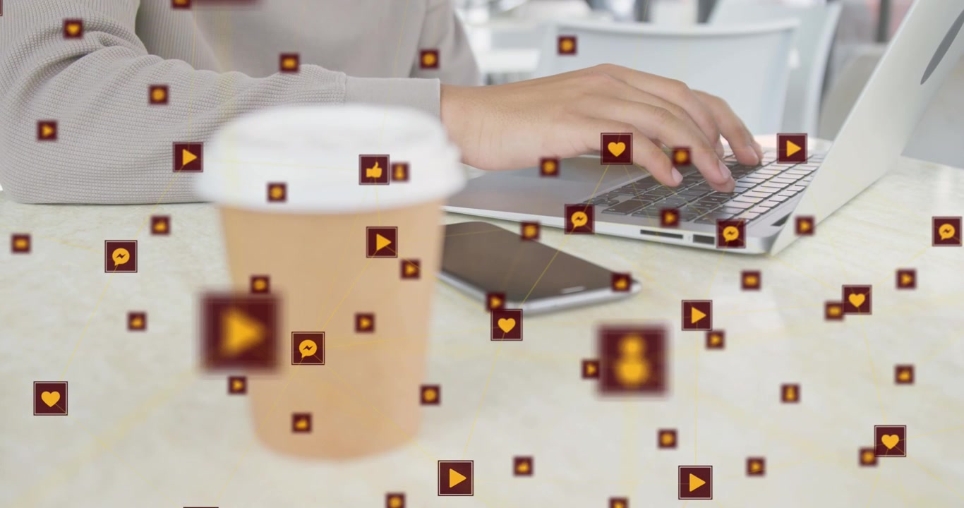 Male hands reaching cup, moving to laptop typing social posts while icons overlaying hands, cup