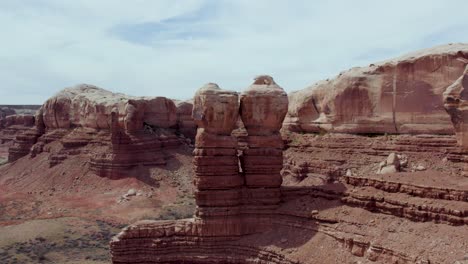 prominent navajo twins eroded rock formation towering over bluff town in utah, usa