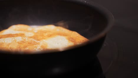 pancake on frying pan. making of pancakes.