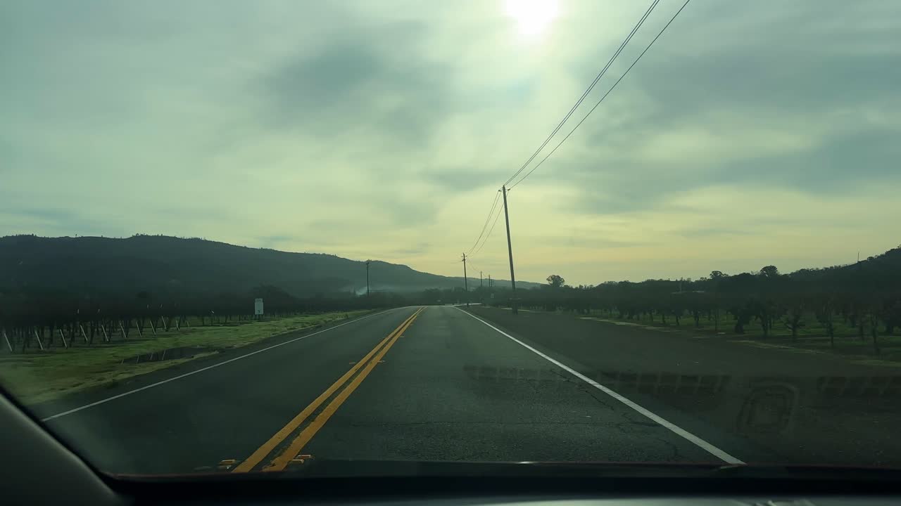 Car POV shot on a rural road through farmland in Napa, California. 4K