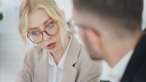 close-up of woman's face during business negotiations