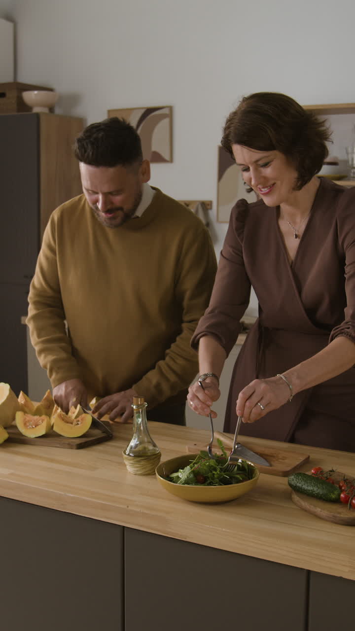 Family Cooking Healthy Salad in Kitchen