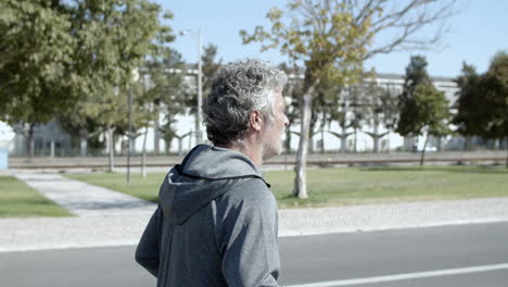 retired male runner jogging outside