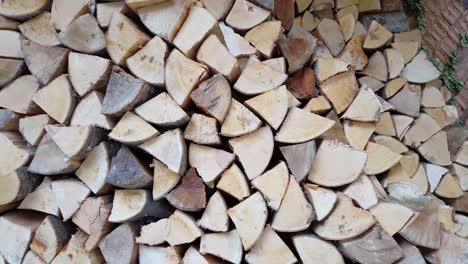 stack of firewood close up. logs cuts prepared for fireplace