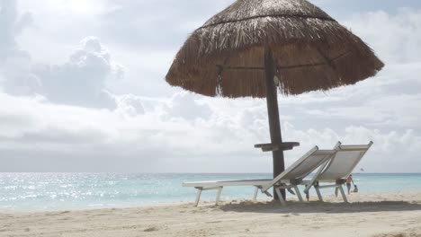 beach beds and sun umbrella at seaside