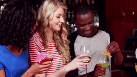 happy friends drinking cocktails