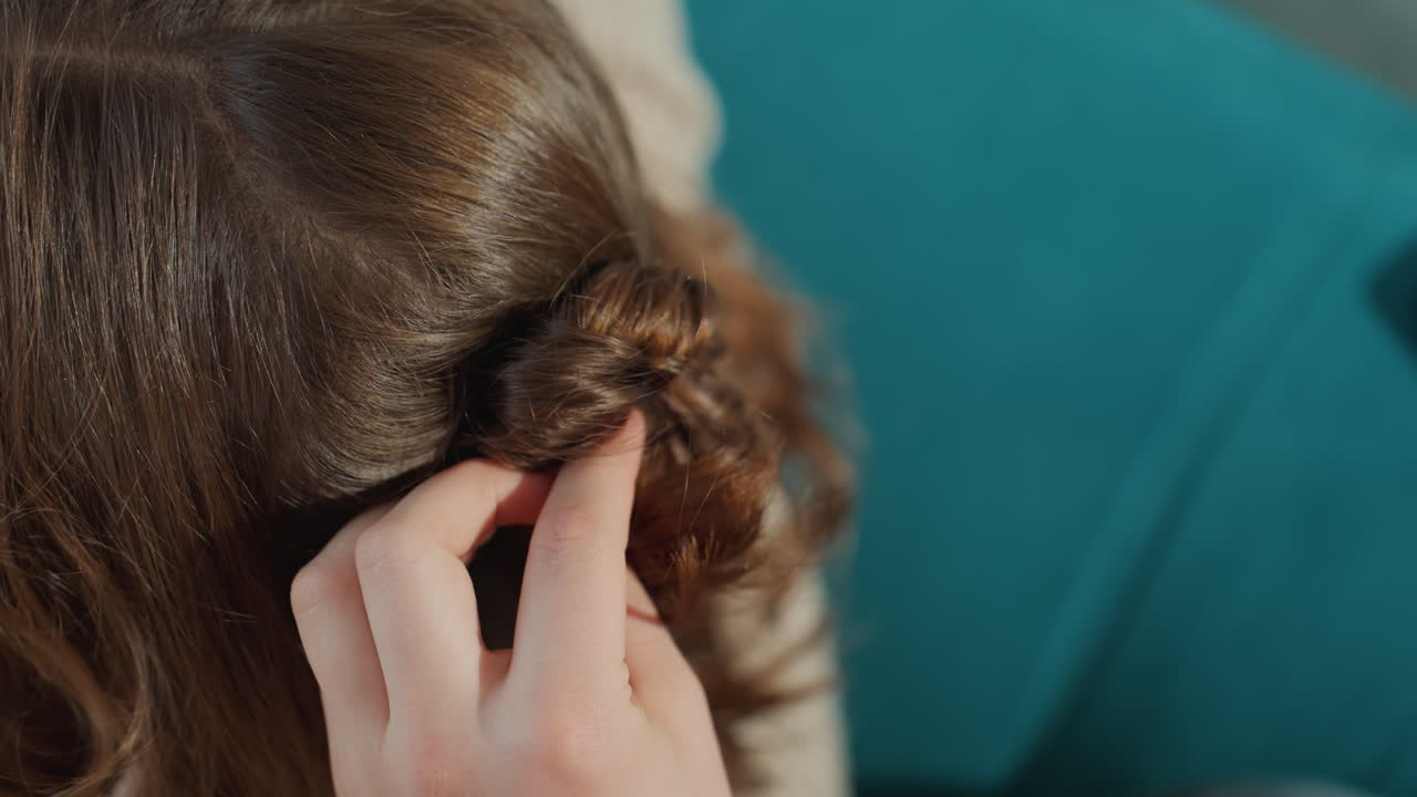 Elegant Hair Styling, Closeup Of Braided Hairstyle, Detailed View Of Twisted Bun With Hairpin Attachment, Intimate Scene Of Woman Styling Textured Braid Into Sophisticated Updo Indoors