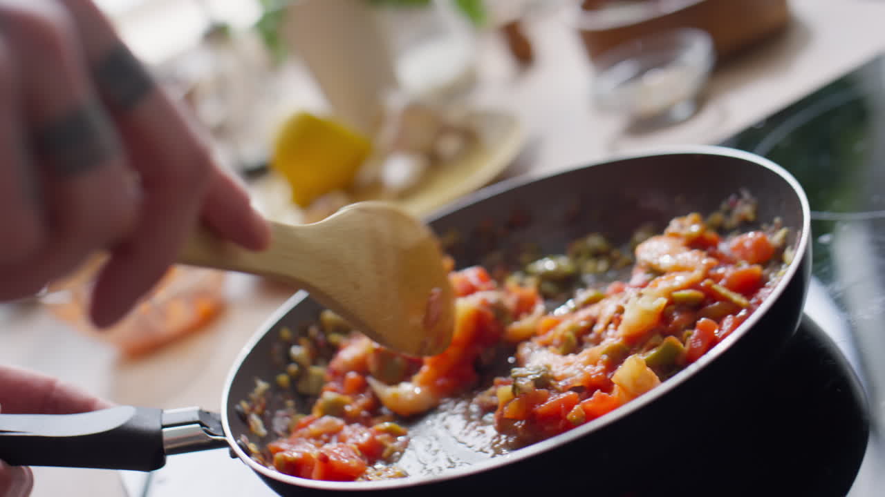 Stirring Ingredients in Frying Pan