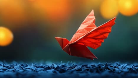 red origami bird in flight