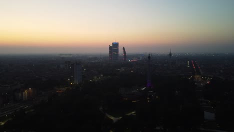 Tre-Torri-district-of-Milan-at-night,-aerial-view