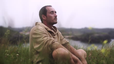 feeling the fragrance of nature meditating hispanic guy