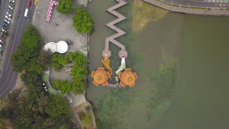 top down view drone shot of dragon tiger pagoda at lotus pond in kaohsiung, taiwan.