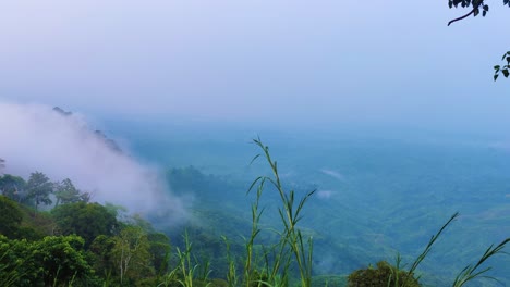 Clouds-rolling-over-forestry-mountains-in-Bangladesh,-moody-foggy-day