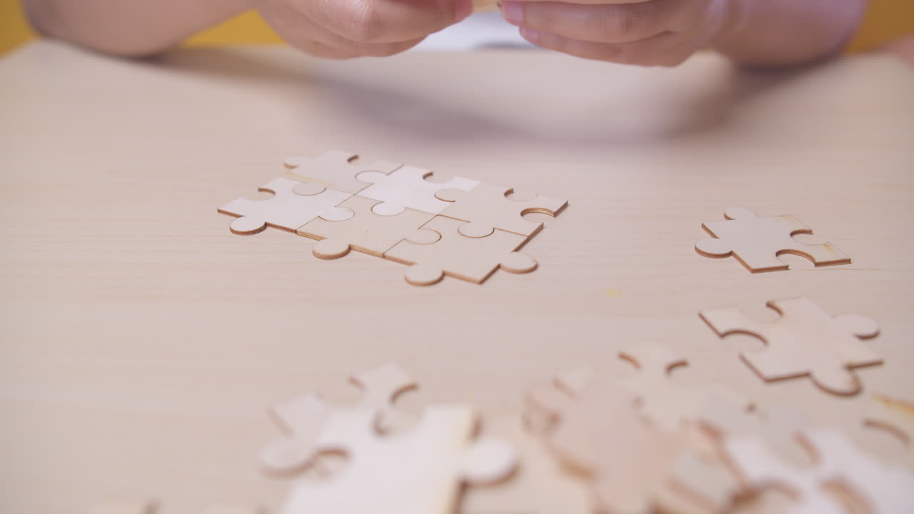 Businesswoman hand connecting jigsaw puzzle with sunlight effect, Business solutions, success, and strategy concept