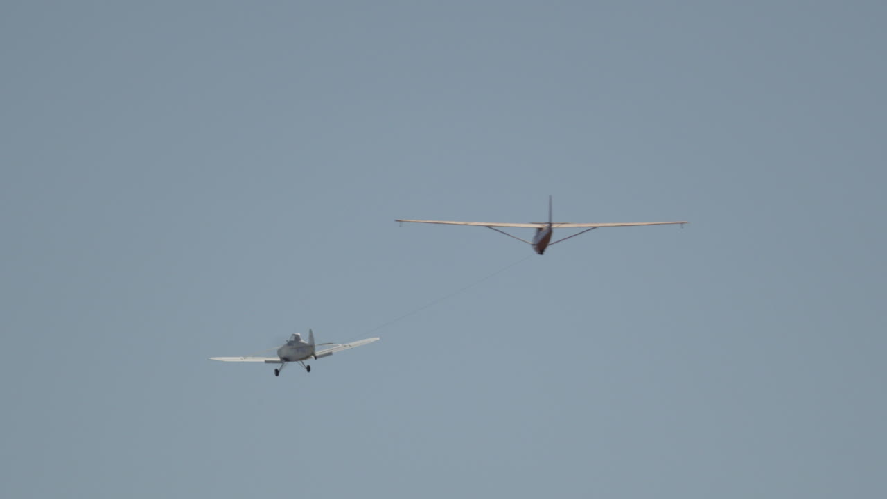 A towplane tows a glider up to altitude for some soaring
