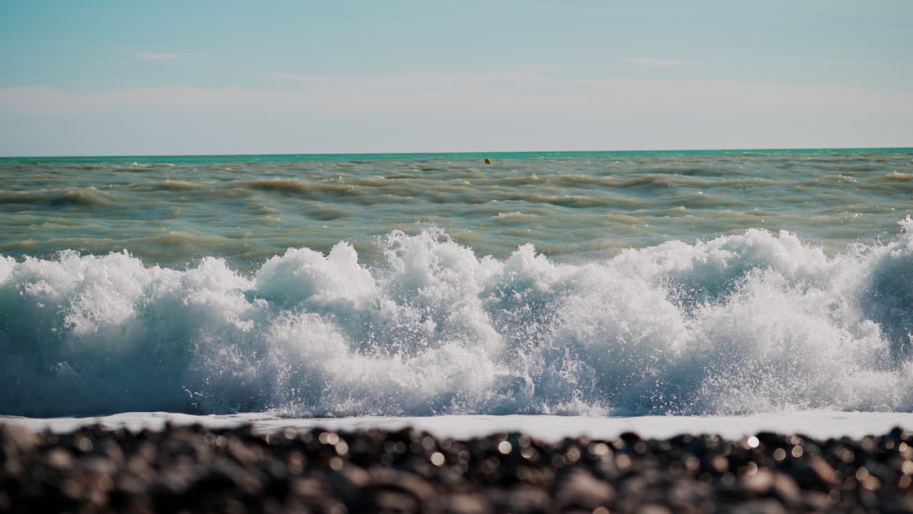 Waves hitting the shore on the beach in Cannes, France
