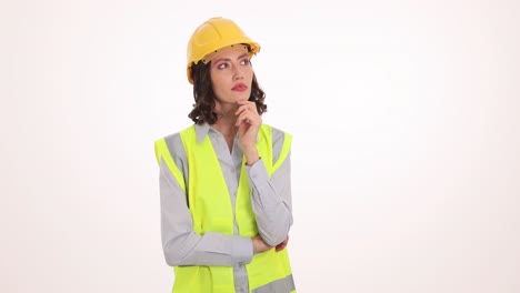 Woman Engineer in Hard Hat and Safety Vest Thinking
