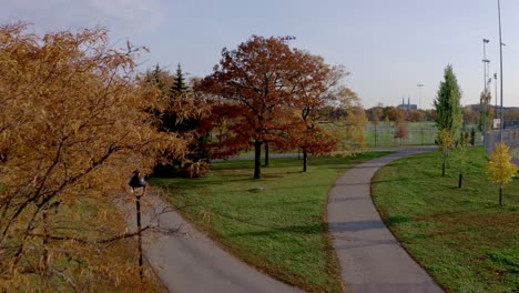 Drone-flying-over-some-walking-path-in-a-public-parc-in-Montreal