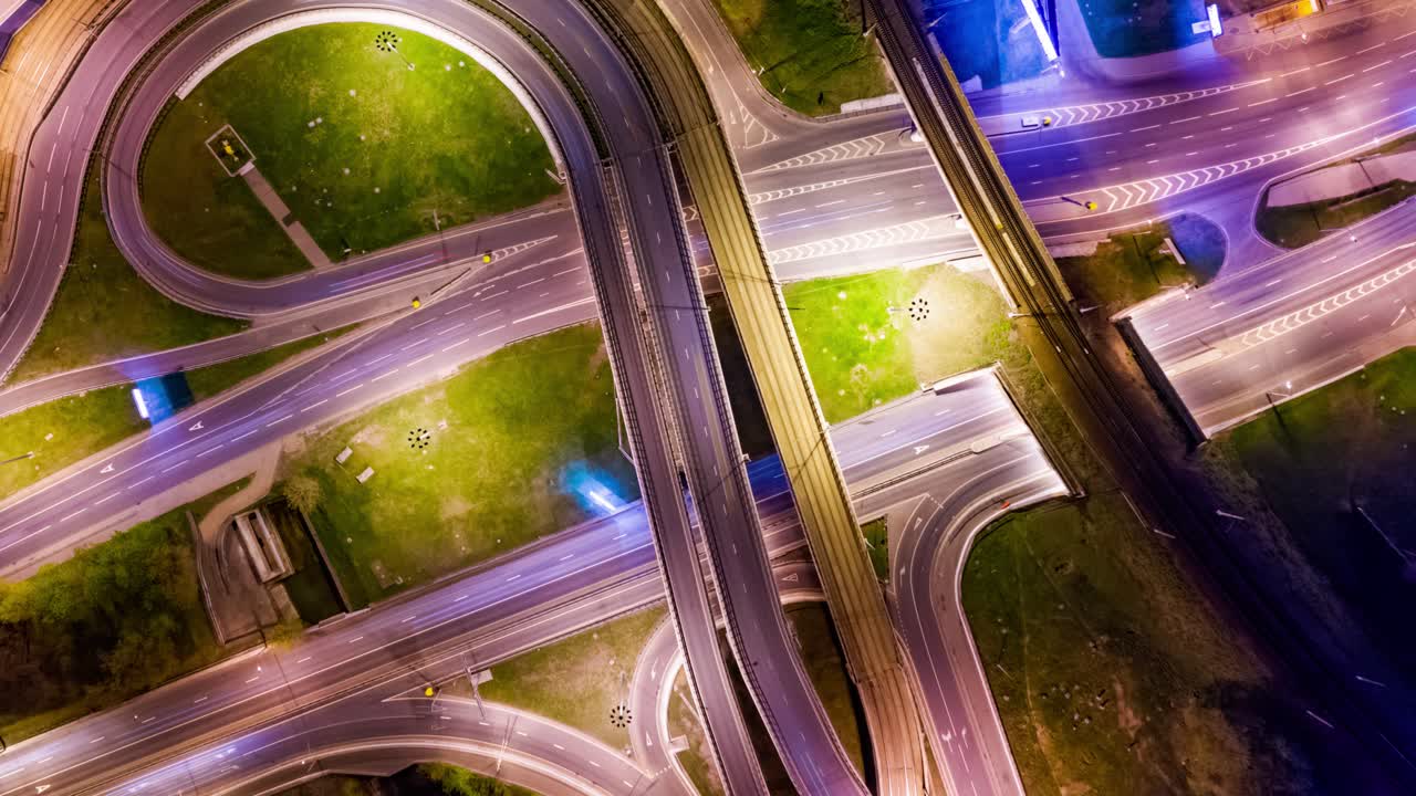 Night Timelapse Aerial view of a freeway intersection traffic trails in night Moscow