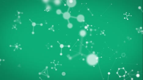 animation of chemical shapes moving in a green background