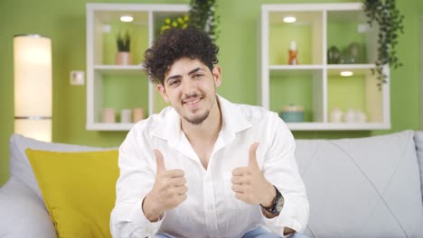 young man nodding positive looking at camera.