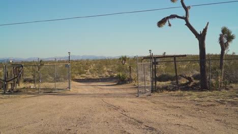 Experience-the-the-open-road-in-this-cinematic-clip-captures-as-a-lone-adventurer-takes-off-from-an-enchanting-old-farm-in-the-heart-of-the-desert,-riding-a-vintage-chopper-motorcycle