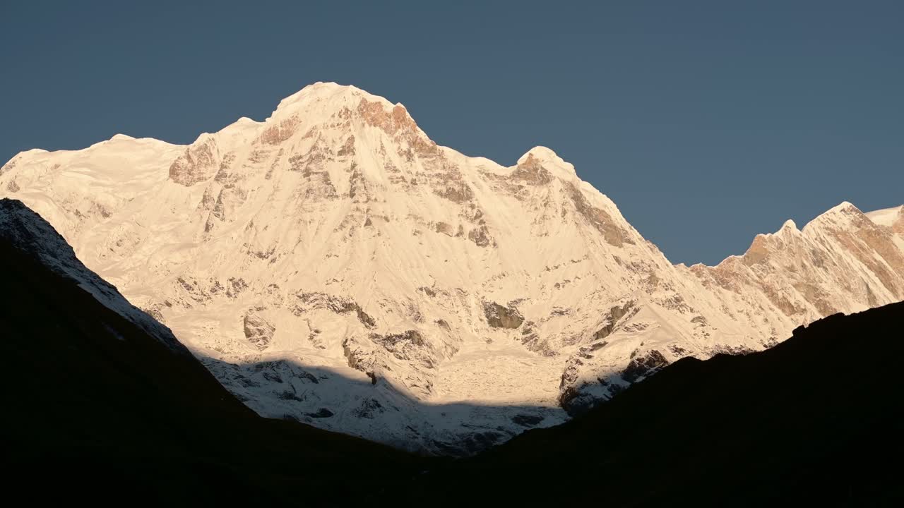 Snowcapped Mountains Close Up and Clear Blue Sky in Nepal, Snowy Winter Himalayas Mountains Covered in Snow in Nepal, Annapurna Mountain Range a Popular Hiking and Trekking Area
