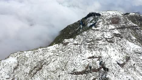 Drone-shot-of-the-ridge-and-its-steep-sides-of-the-mountain-Pico-Ruivo-in-Madeira