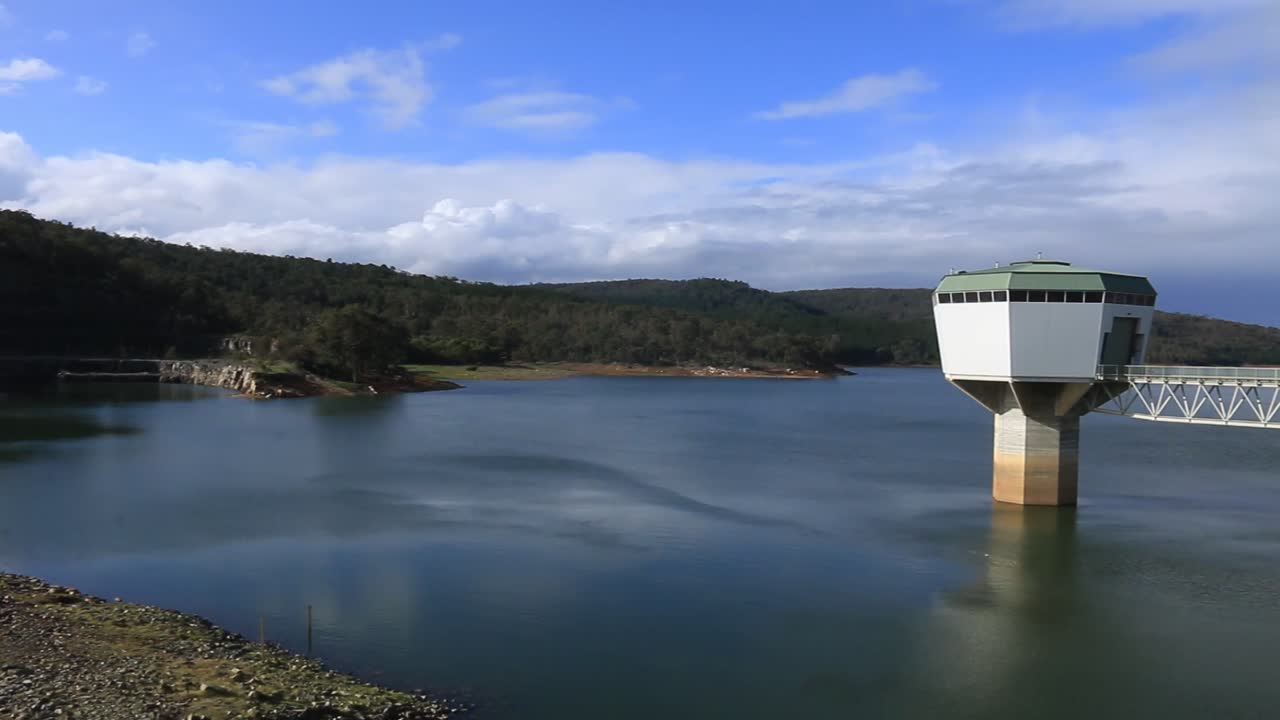 Pan Right Clip Revealing Harvey Dam Water Intake Tower Building And Access Bridge