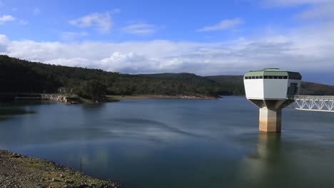 pan right clip revealing harvey dam water intake tower building and access bridge