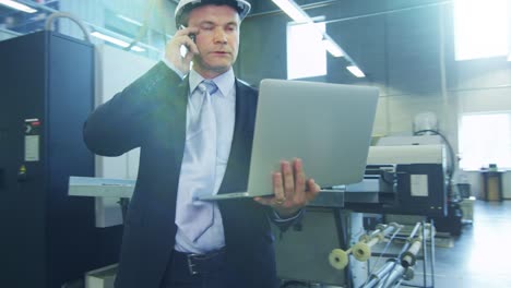 businessman on the phone on factory