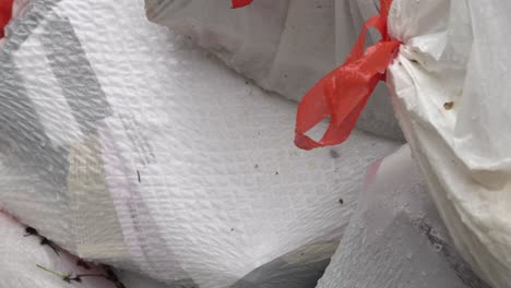 close up shot of a pile of garbage bags