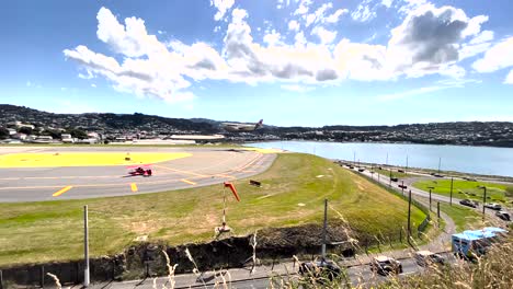 airplane arriving and landing at the airport runway in daytime