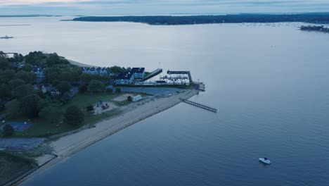 Aerial-Drone-shot-of-Orient-Greenport-North-Fork-Long-Island-New-York-before-sunrise-with-ferry-and-houses