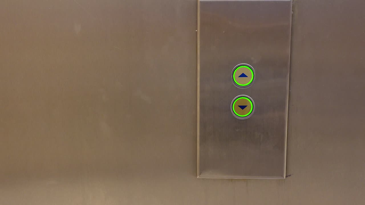 Person Pressing Elevator Buttons