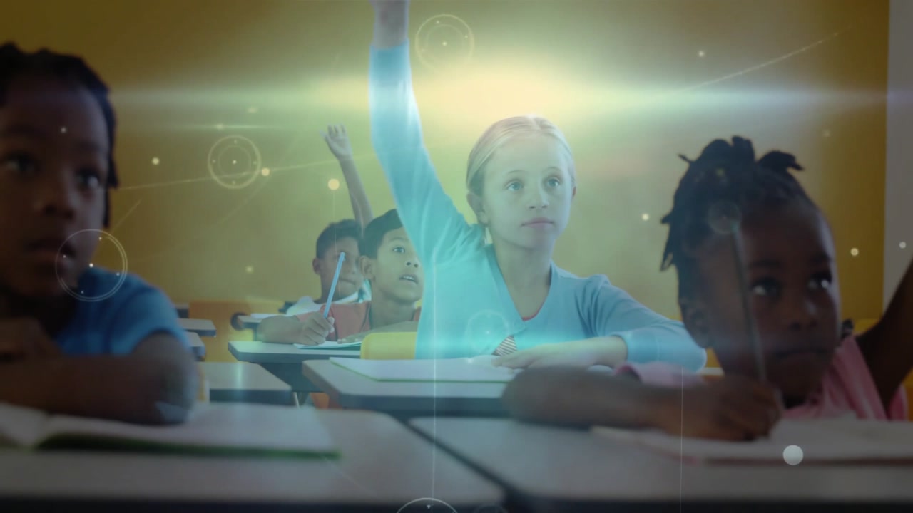 Primary student writing note activating education overlays classmates raising hands