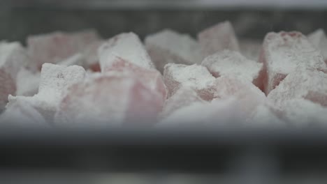 close-up of individual squares of sugared turkish delight