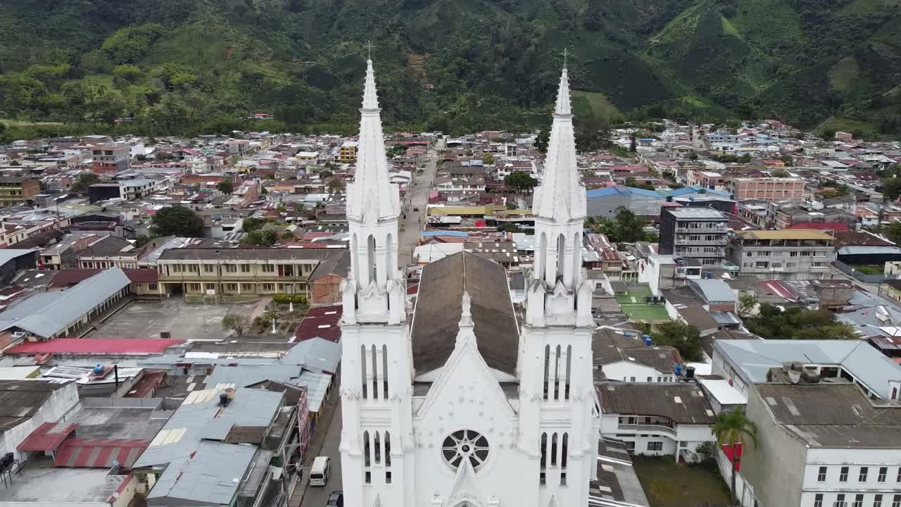 Aerial View of a Majestic White Church in a Mountain Town