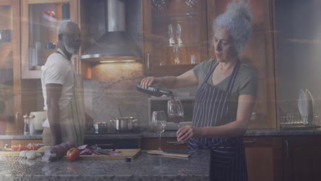 pouring wine, woman in kitchen with older man watching animation on tablet