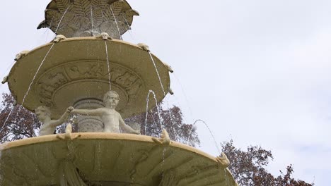 water flowing from ornate multi-tiered fountain