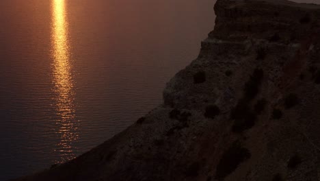 sunset over a rocky coastline