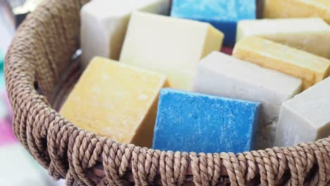 assortment of colorful handmade soaps in a basket