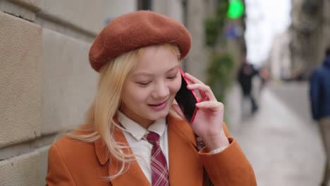 woman talking on the phone on a city street