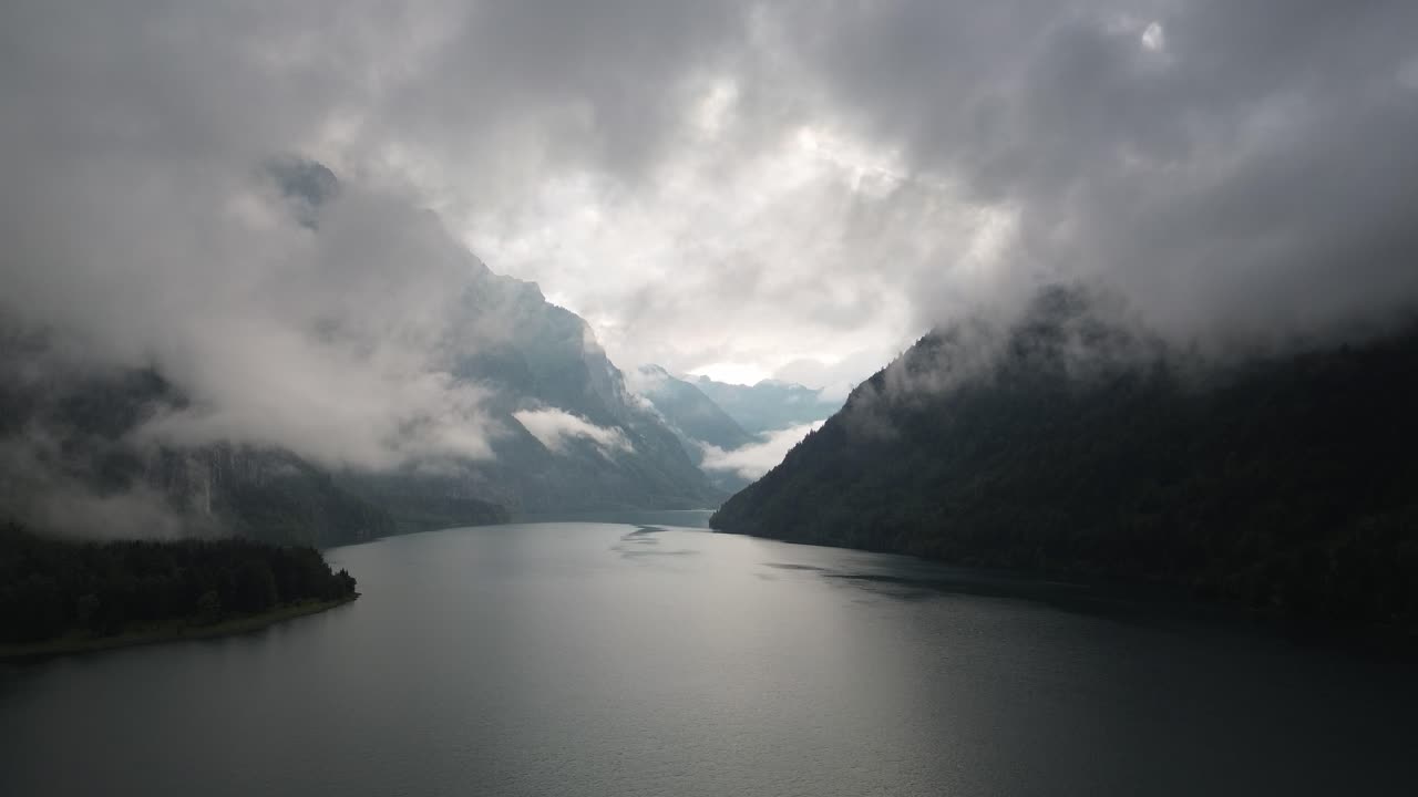 Dramatic Misty Mountains and Lake Landscape