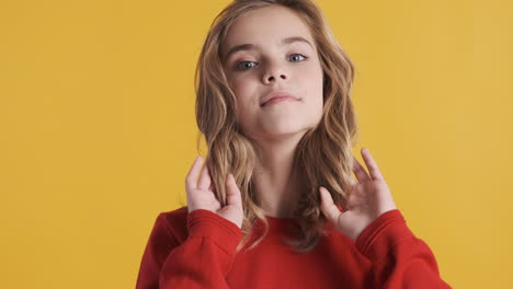 teenage caucasian girl posing in front of the camera.