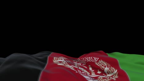 afghanistan fabric flag waving on the wind loop. afghan embroidery stiched cloth banner swaying on the breeze. half-filled black background. place for text. 20 seconds loop.