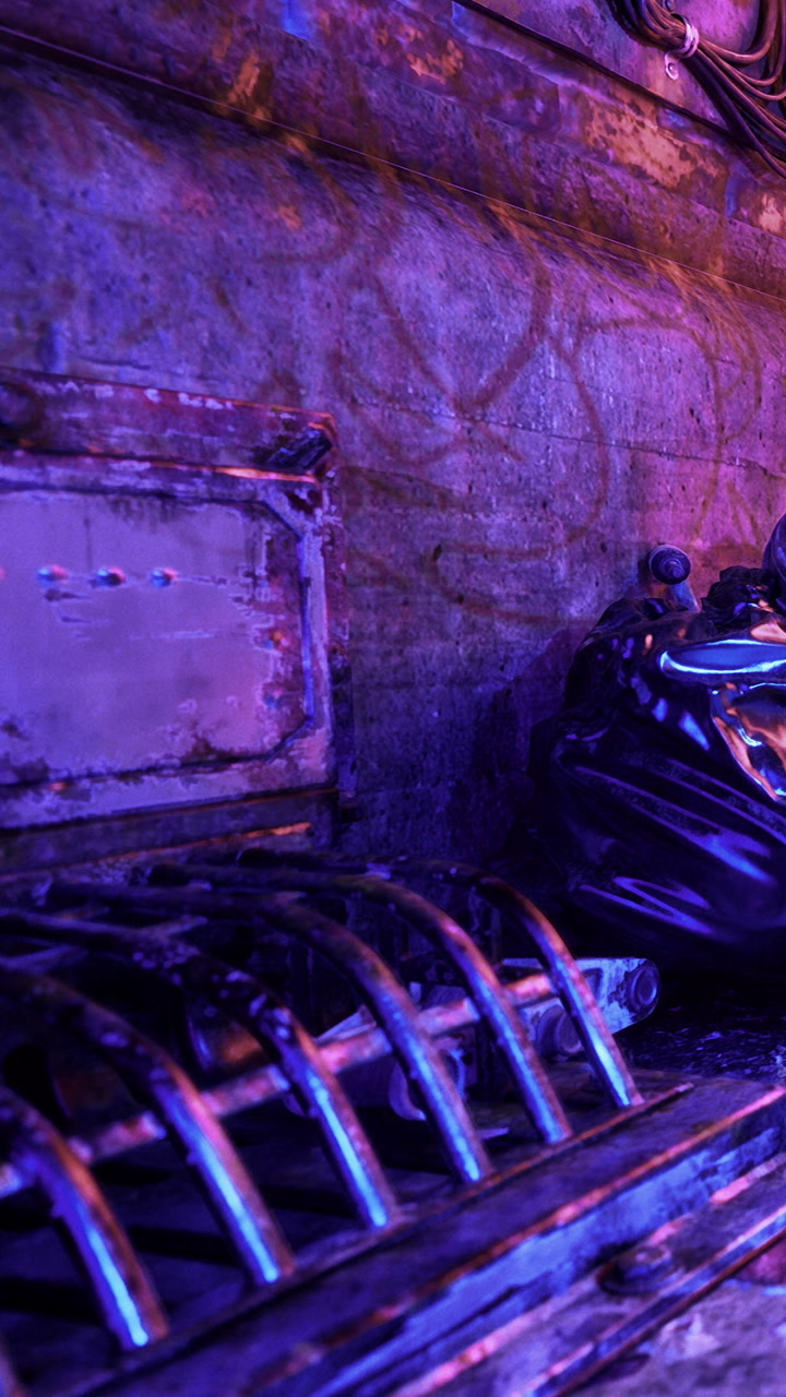 Old machinery with colorful light in a dim room at night time