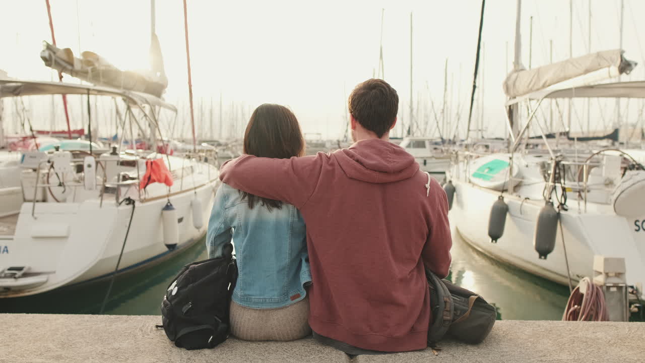 Couple admiring yachts in harbor
